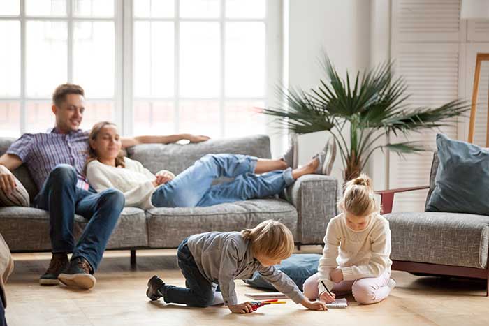 family relaxing in living room